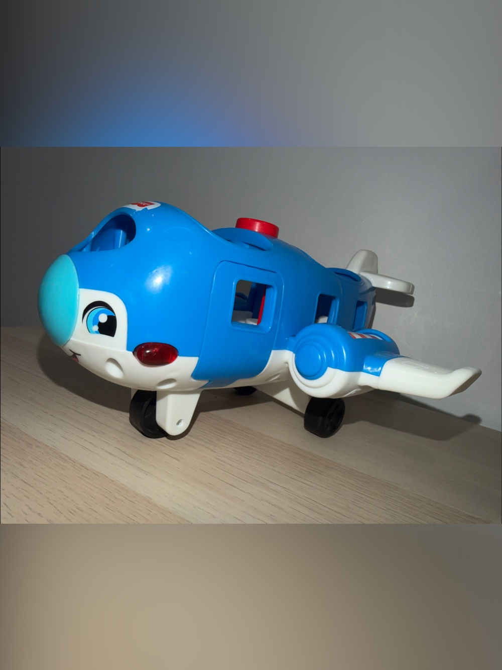 Fisher-Price Blue and White Toy Airplane with Red Accents